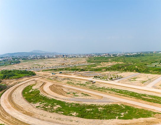 Undeveloped area with distant city and hills